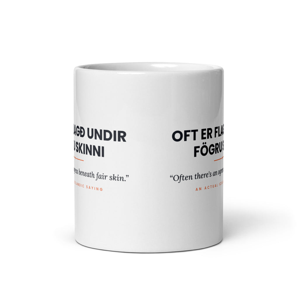 View opposite the handle of the white 11 oz Oft er flagð undir fögru skinni mug, showing the gap between the two repeats of the design.