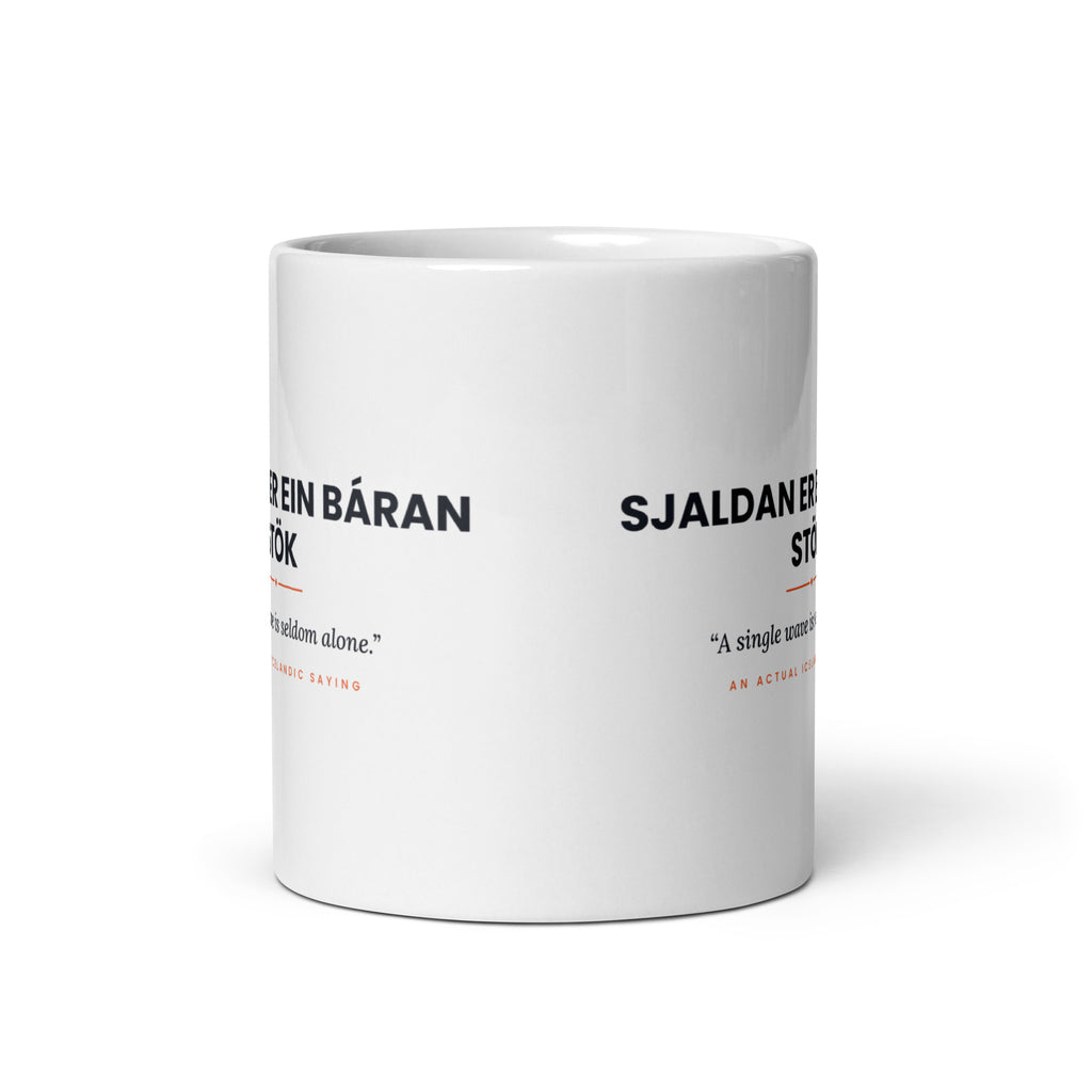 View opposite the handle of the white 11 oz Sjaldan er ein báran stök mug, showing the gap between the two repeats of the design.
