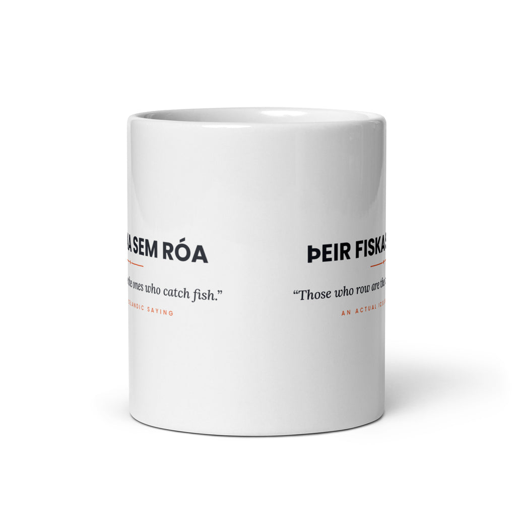 View opposite the handle of the white 11 oz Þeir fiska sem róa mug, showing the gap between the two repeats of the design.