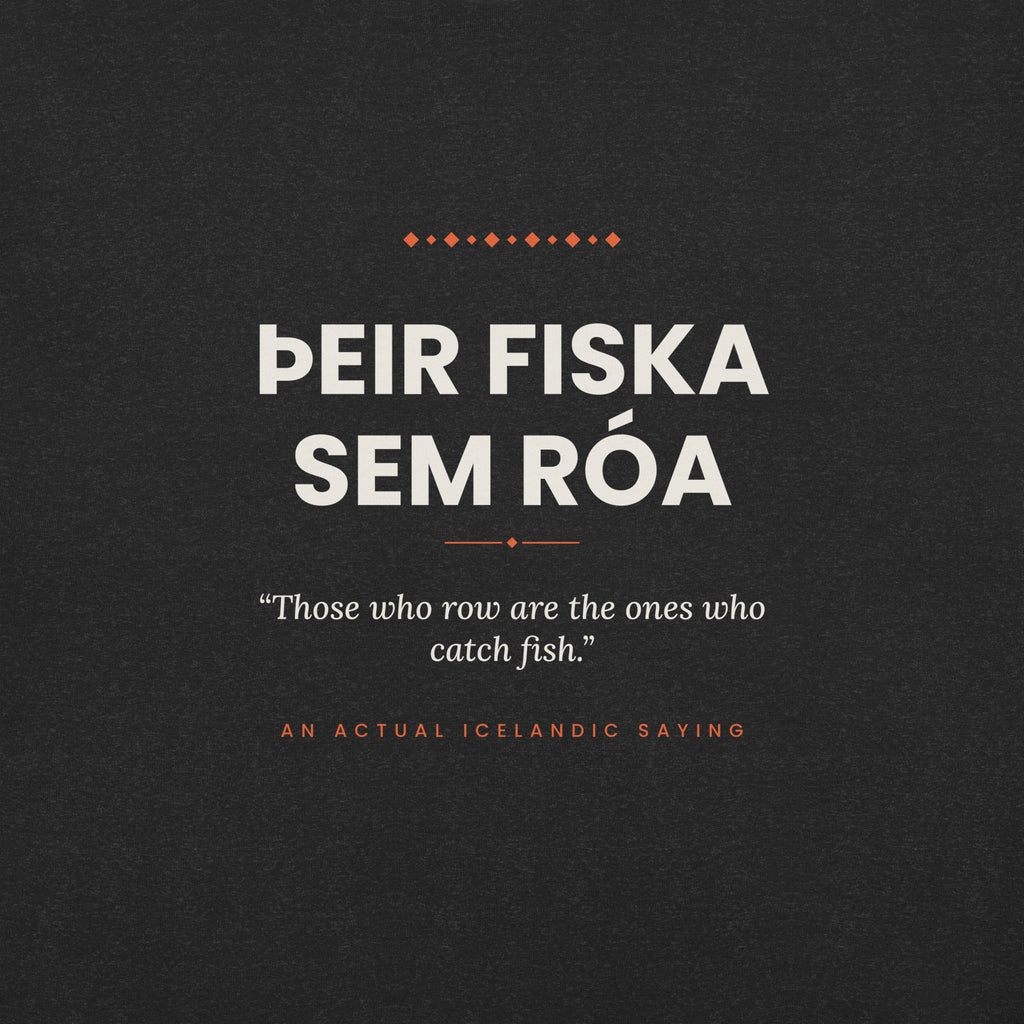 Close-up of the Þeir fiska sem róa front print, showing cream lettering, English translation and coral accents on Black Heather fabric.