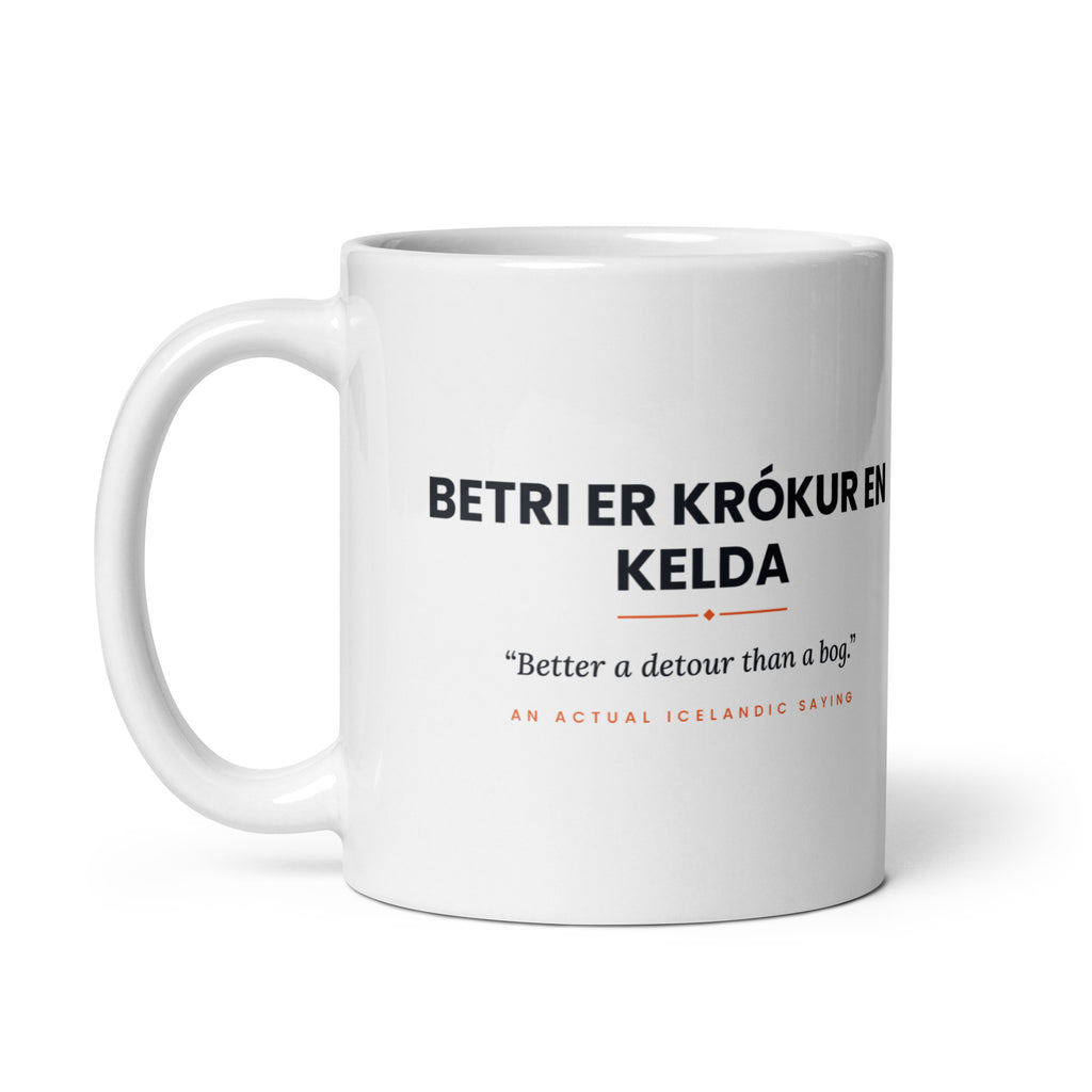 White 11 oz Betri er krókur en kelda mug, handle on the left, showing the repeated saying on the other side.
