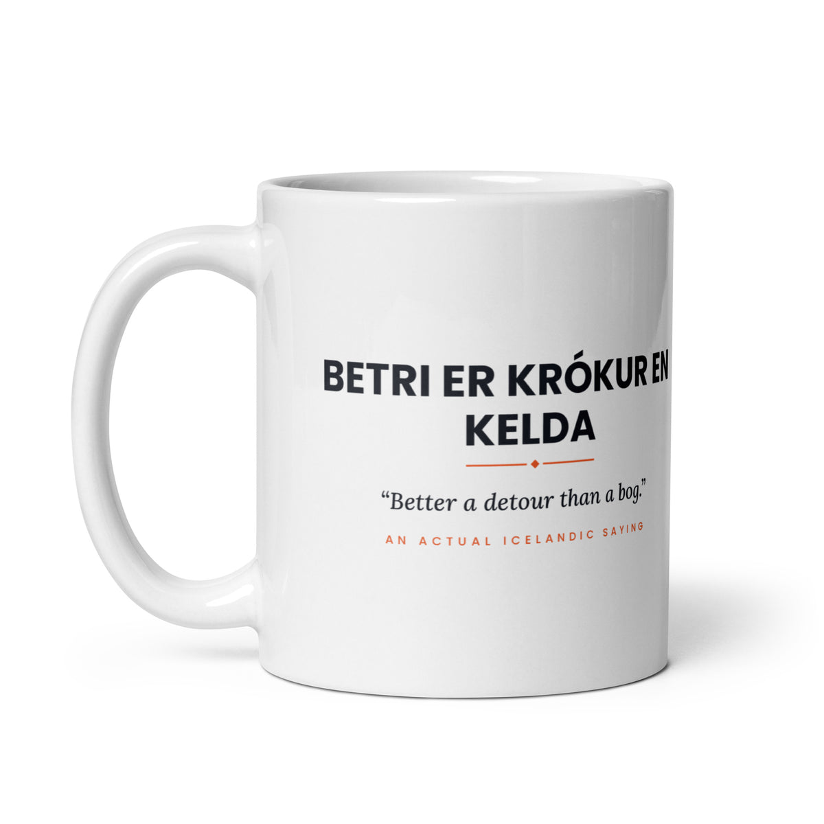 White 11 oz Betri er krókur en kelda mug, handle on the left, showing the repeated saying on the other side.