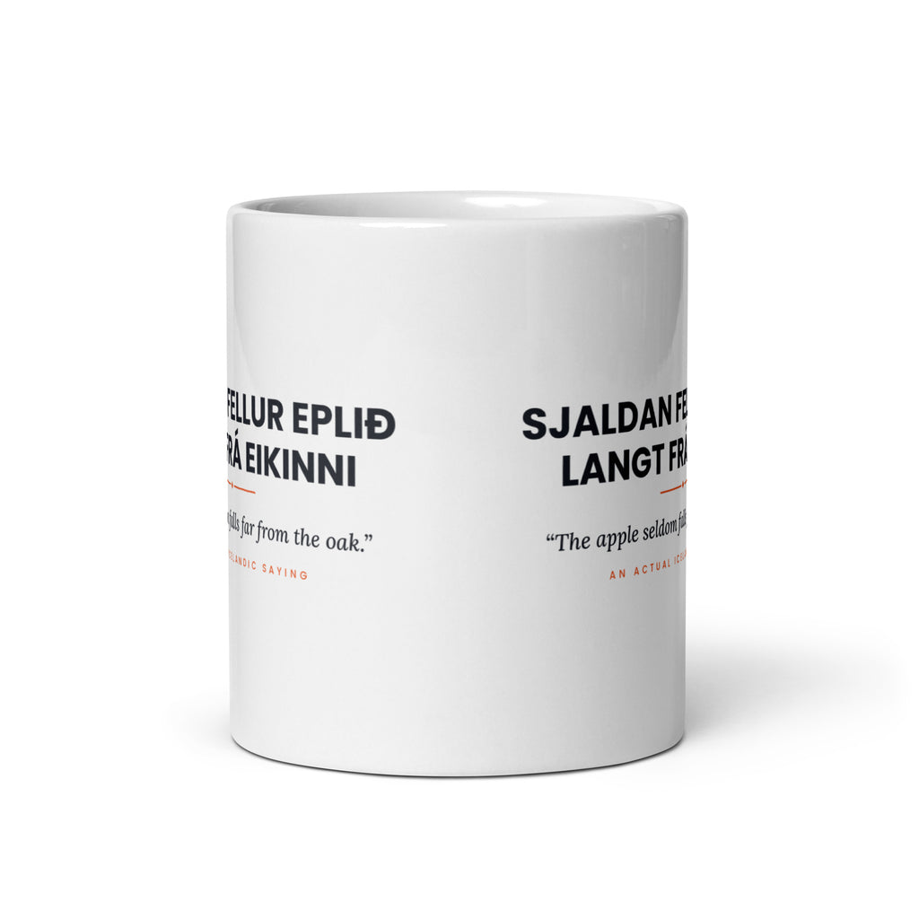 View opposite the handle of the white 11 oz Sjaldan fellur eplið langt frá eikinni mug, showing the gap between the two repeats of the design.