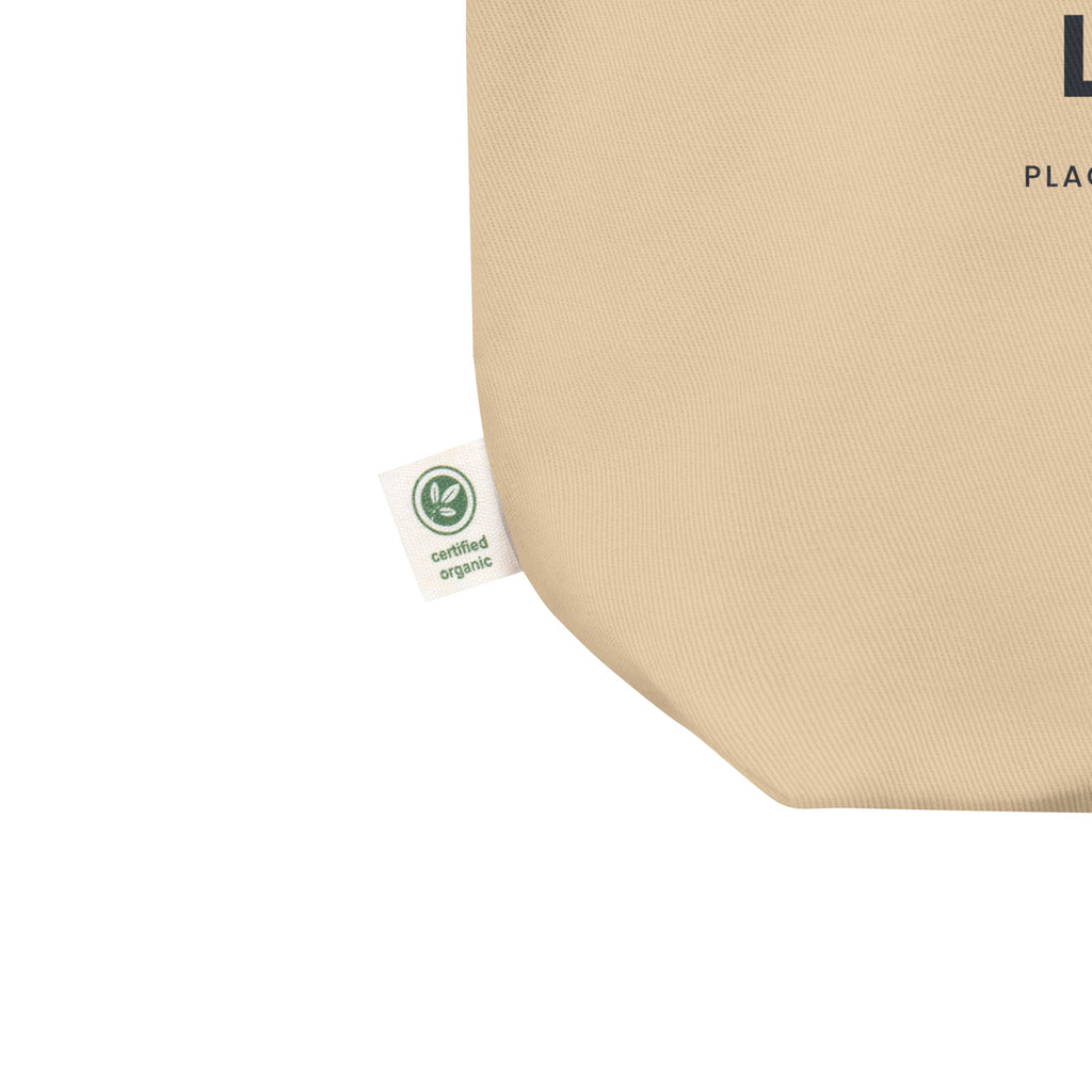 Close-up of the Oyster Iceland, Literally tote, showing the bottom seam, woven fabric and side label.