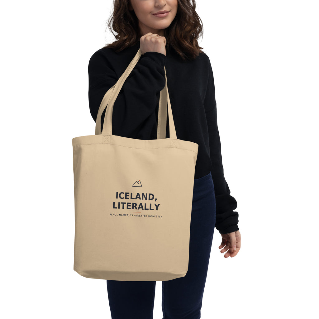 Model carrying the Oyster Iceland, Literally tote, showing the front print and the bag in use.