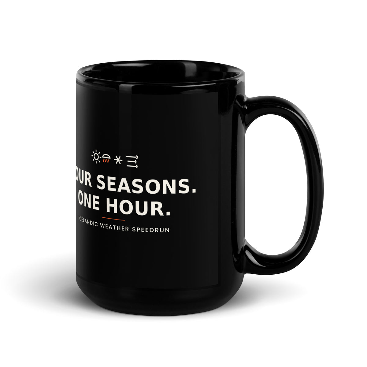 Black 15 oz Four Seasons. One Hour. mug, handle on the right, showing the printed slogan.