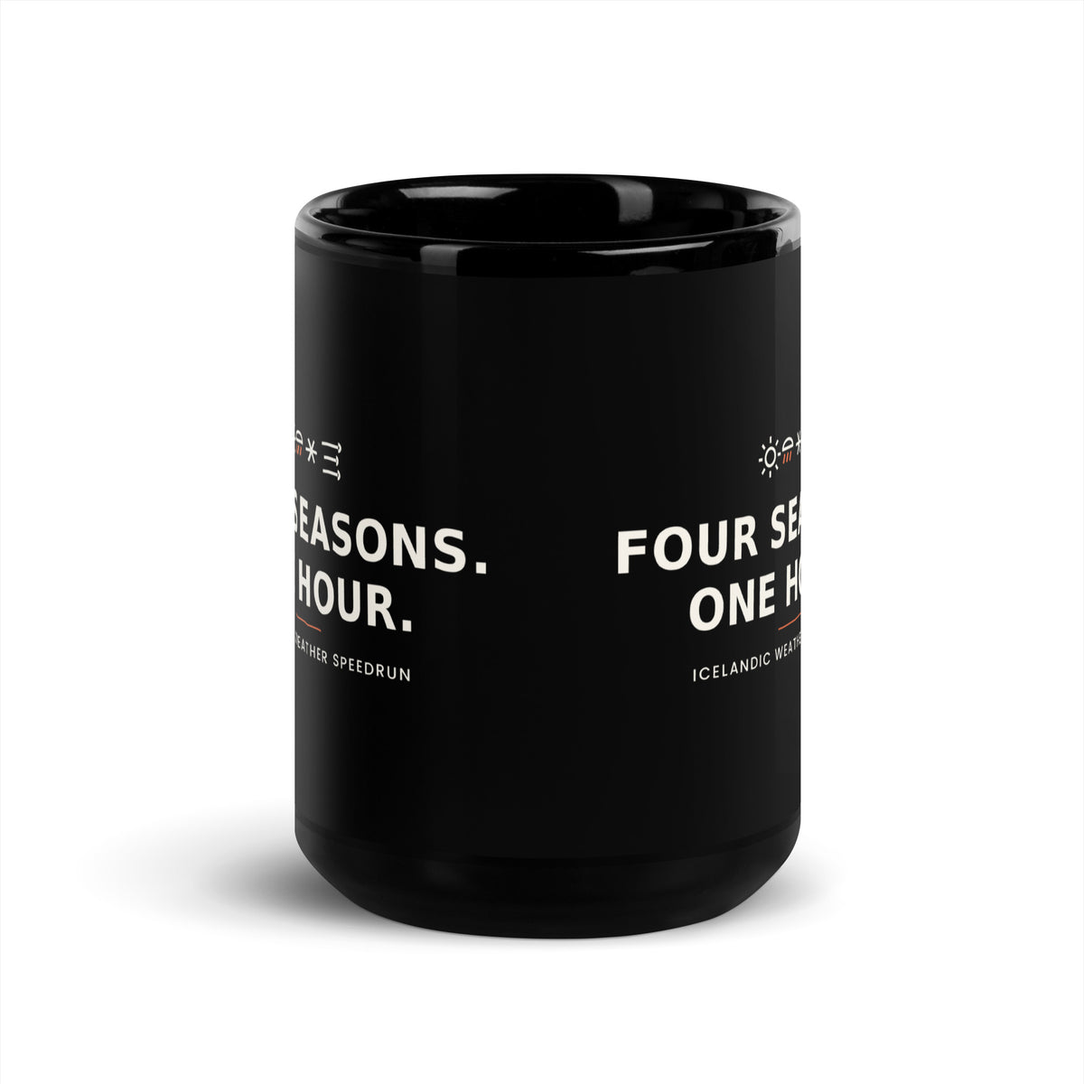 Black 15 oz Four Seasons. One Hour. mug, viewed opposite the handle, showing the gap between the repeated slogans.