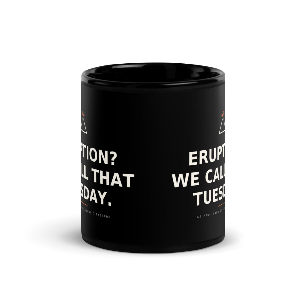 Black 11 oz Eruption? We Call That Tuesday. mug, viewed opposite the handle, showing the gap between the repeated slogans.