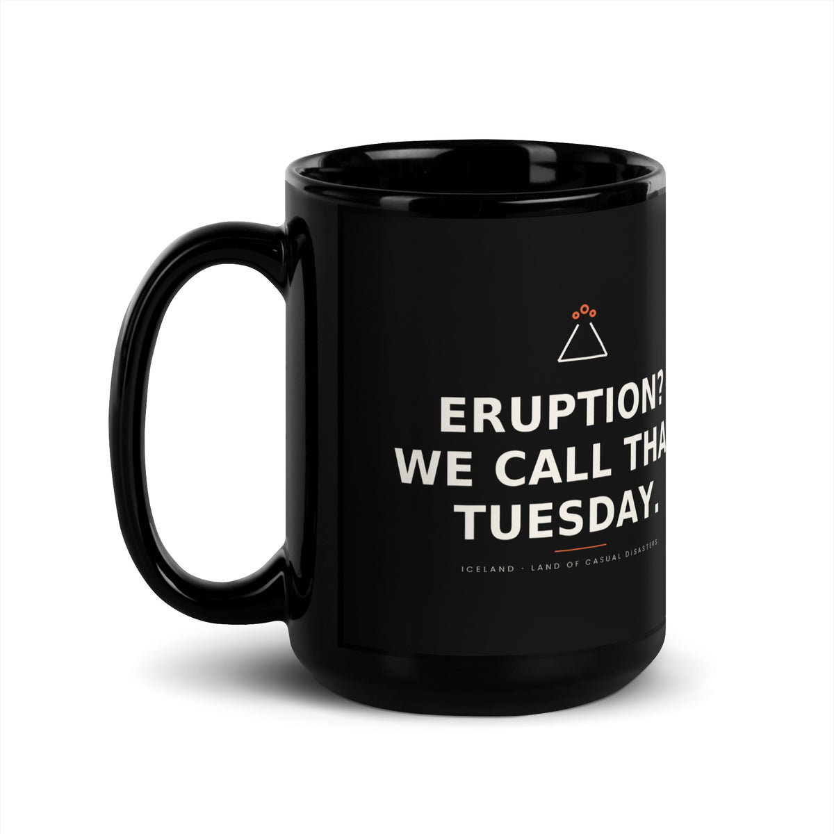 Black 15 oz Eruption? We Call That Tuesday. mug, handle on the left, showing the printed slogan.
