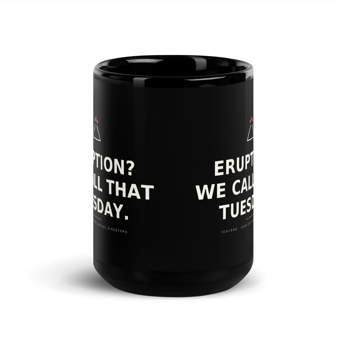 Black 15 oz Eruption? We Call That Tuesday. mug, viewed opposite the handle, showing the gap between the repeated slogans.