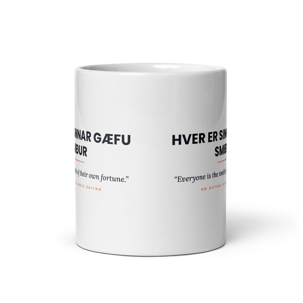 View opposite the handle of the white 11 oz Hver er sinnar gæfu smiður mug, showing the gap between the two repeats of the design.