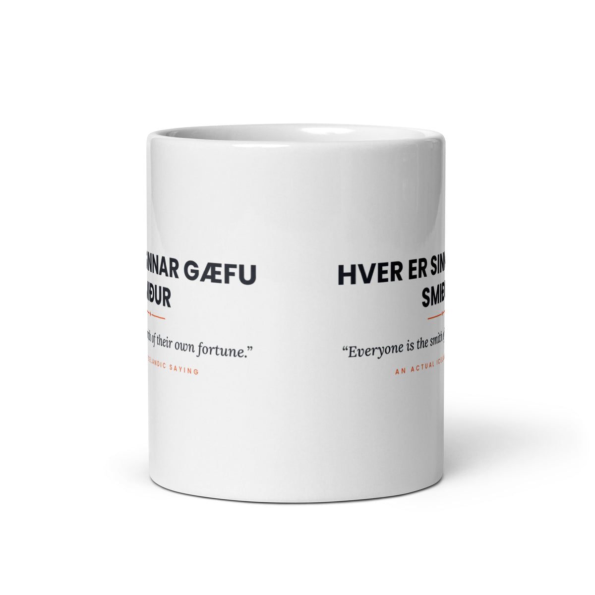 View opposite the handle of the white 11 oz Hver er sinnar gæfu smiður mug, showing the gap between the two repeats of the design.