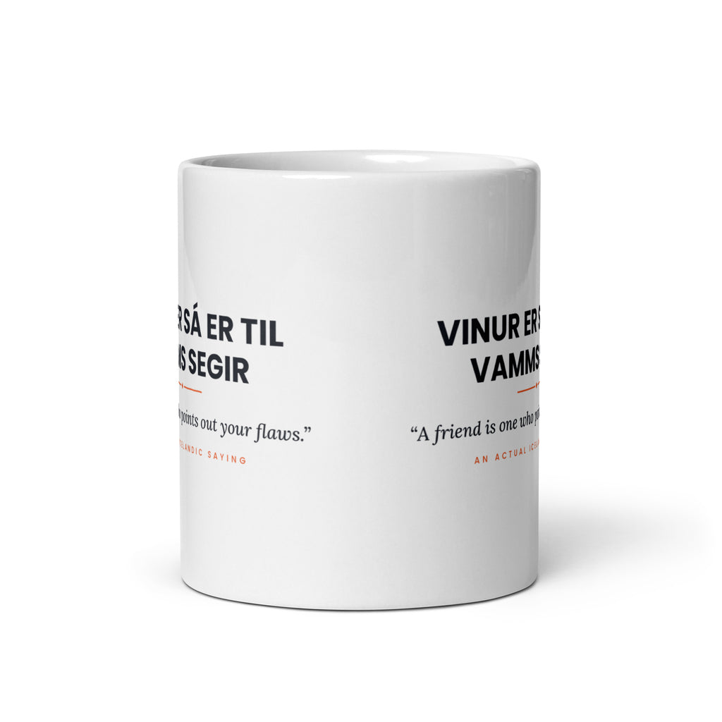 View opposite the handle of the white 11 oz Vinur er sá er til vamms segir mug, showing the gap between the two repeats of the design.