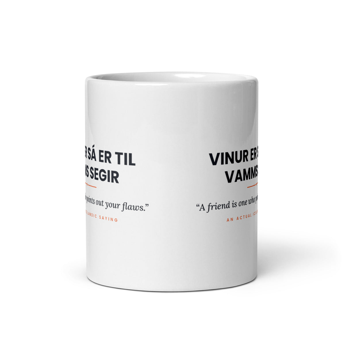 View opposite the handle of the white 11 oz Vinur er sá er til vamms segir mug, showing the gap between the two repeats of the design.