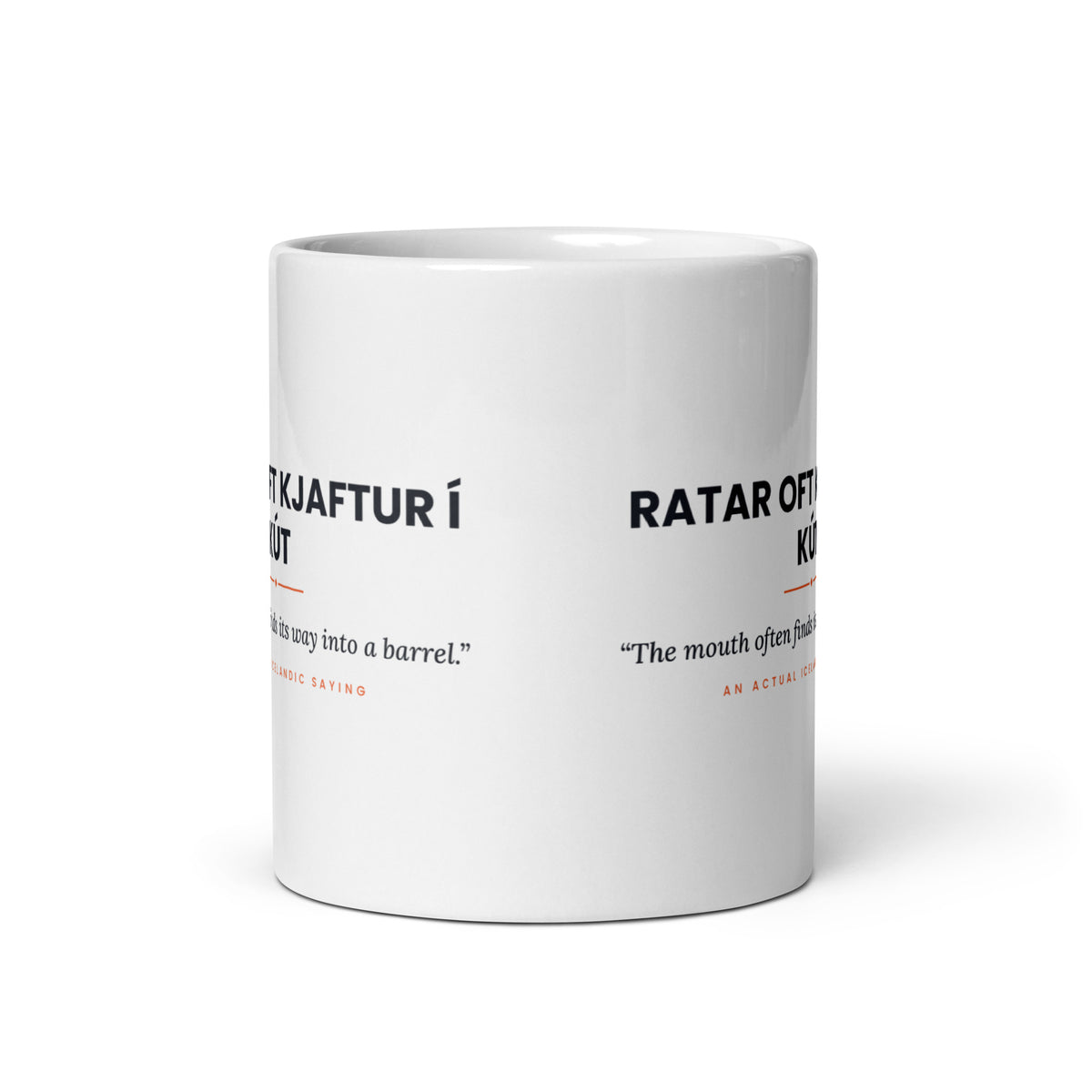View opposite the handle of the white 11 oz Ratar oft kjaftur í kút mug, showing the gap between the two repeats of the design.