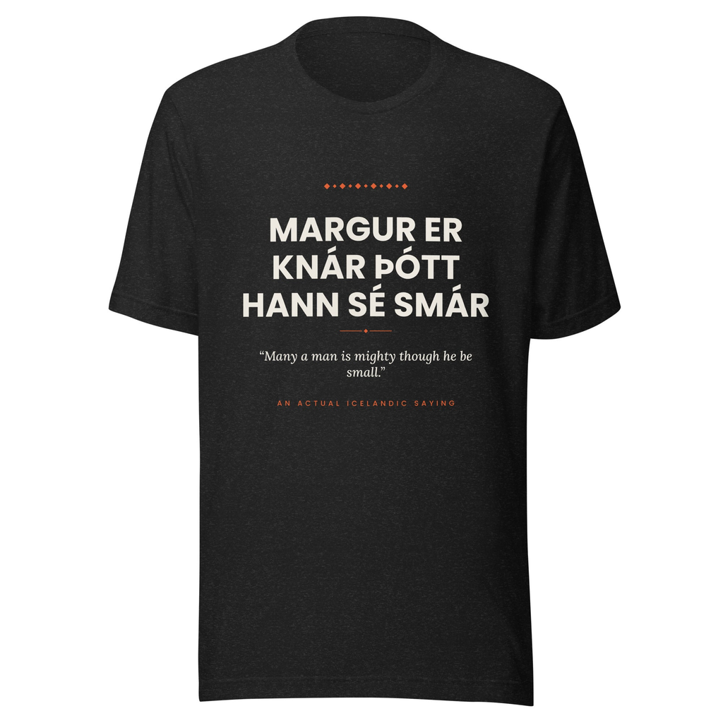 Front view of the Black Heather Margur er knár þótt hann sé smár tee, with cream lettering, English translation and coral accents.
