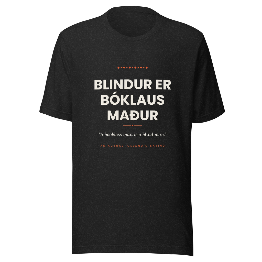Front view of the Black Heather Blindur er bóklaus maður tee, with cream lettering, English translation and coral accents.
