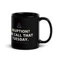 Black 11 oz Eruption? We Call That Tuesday. mug, handle on the right, showing the printed slogan.