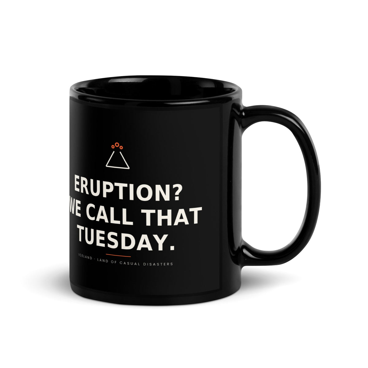 Black 11 oz Eruption? We Call That Tuesday. mug, handle on the right, showing the printed slogan.